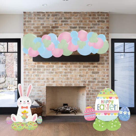 Decorative Easter setup with balloons, bunny, and eggs in front of a fireplace.