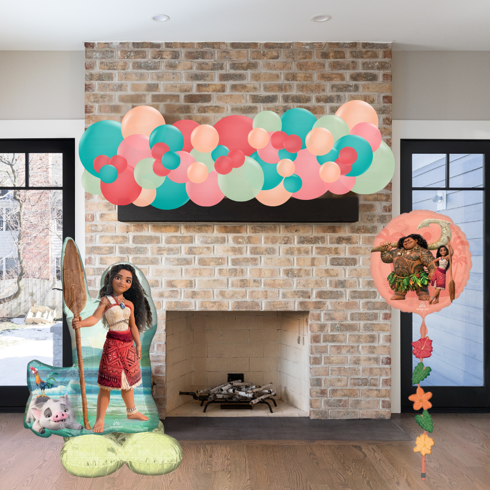 Decorative setup with Moana-themed cutouts in a living room.
