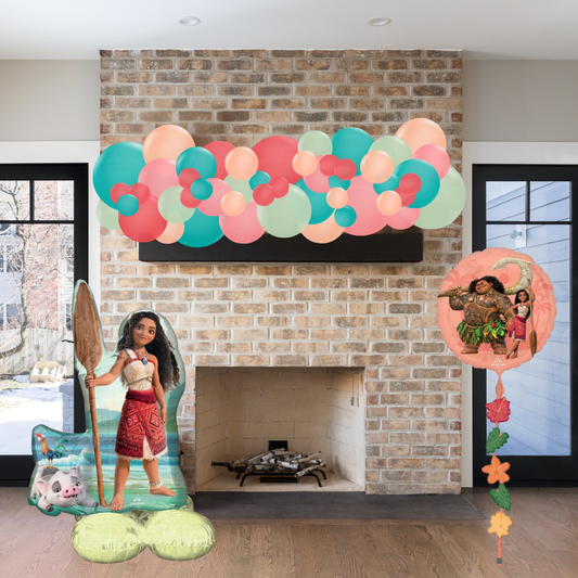 Decorative setup with Moana-themed cutouts in a living room.